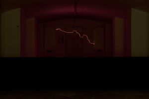 *Coup d’éclat*, exhibition view, Fort du Bruissin. Featuring Marcela Armas, *Resitencia*, 2009, heating resistance, insulators, steel cord, sensors and electricity. Photo: Blaise Adilon