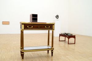 View of the exhibition *Je préfère être dérangé*, gallery of the École supérieure d’art de Grenoble, from 3 to 9 December 2013. Console and table from the 19th century from the collection of Bruno Henry.