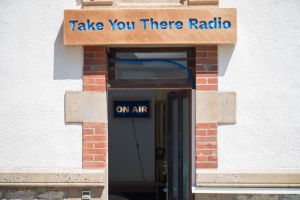 Façade of the Conciergerie and entrance to the *Take You There Radio* studio, June 2015.